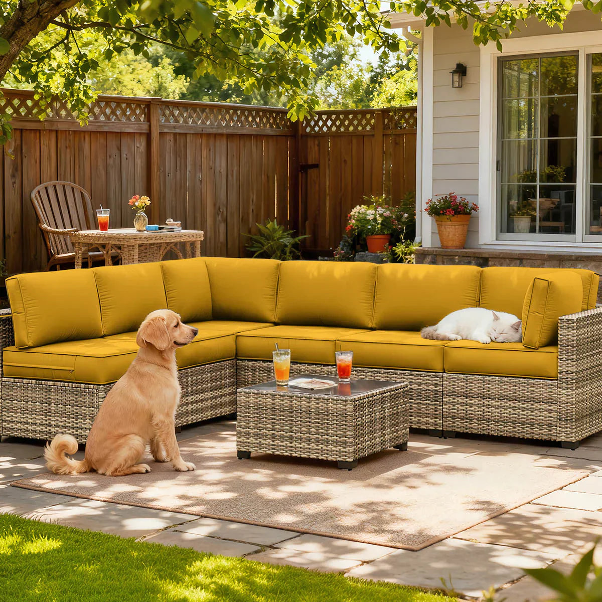 Pet-friendly patio cushions on an outdoor sectional sofa with a dog and cat relaxing in a backyard patio space