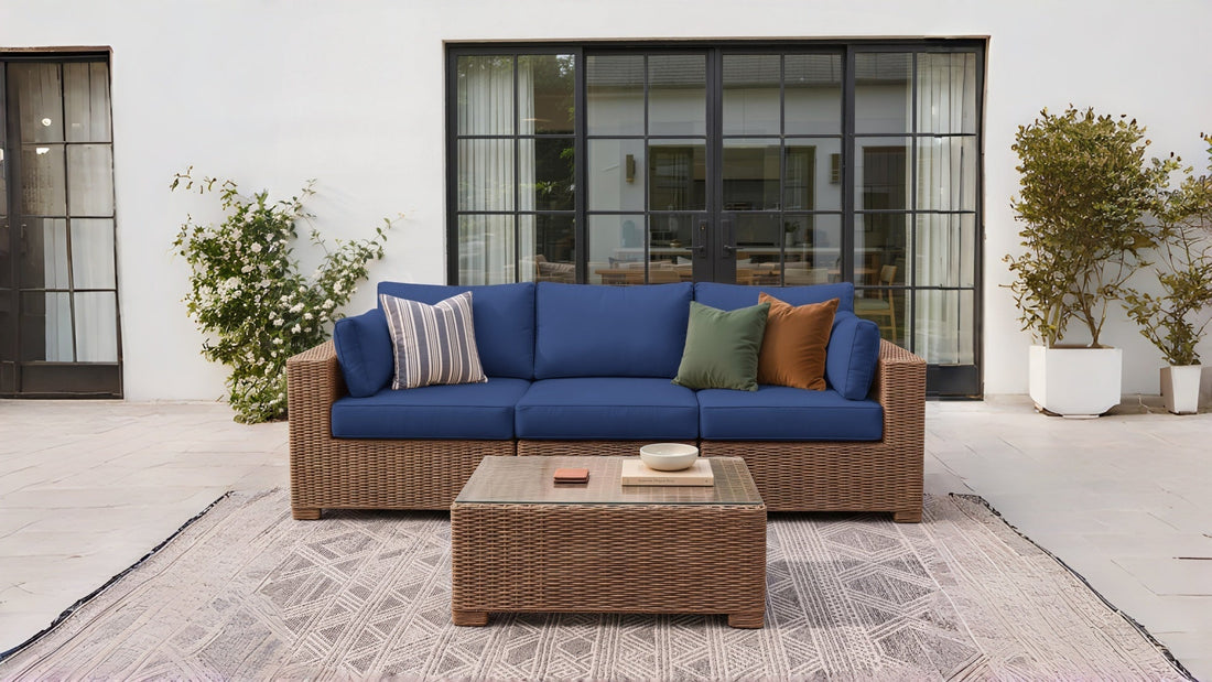 Replacement cushions for outdoor furniture arranged on a patio sectional sofa with matching seat and back cushions.