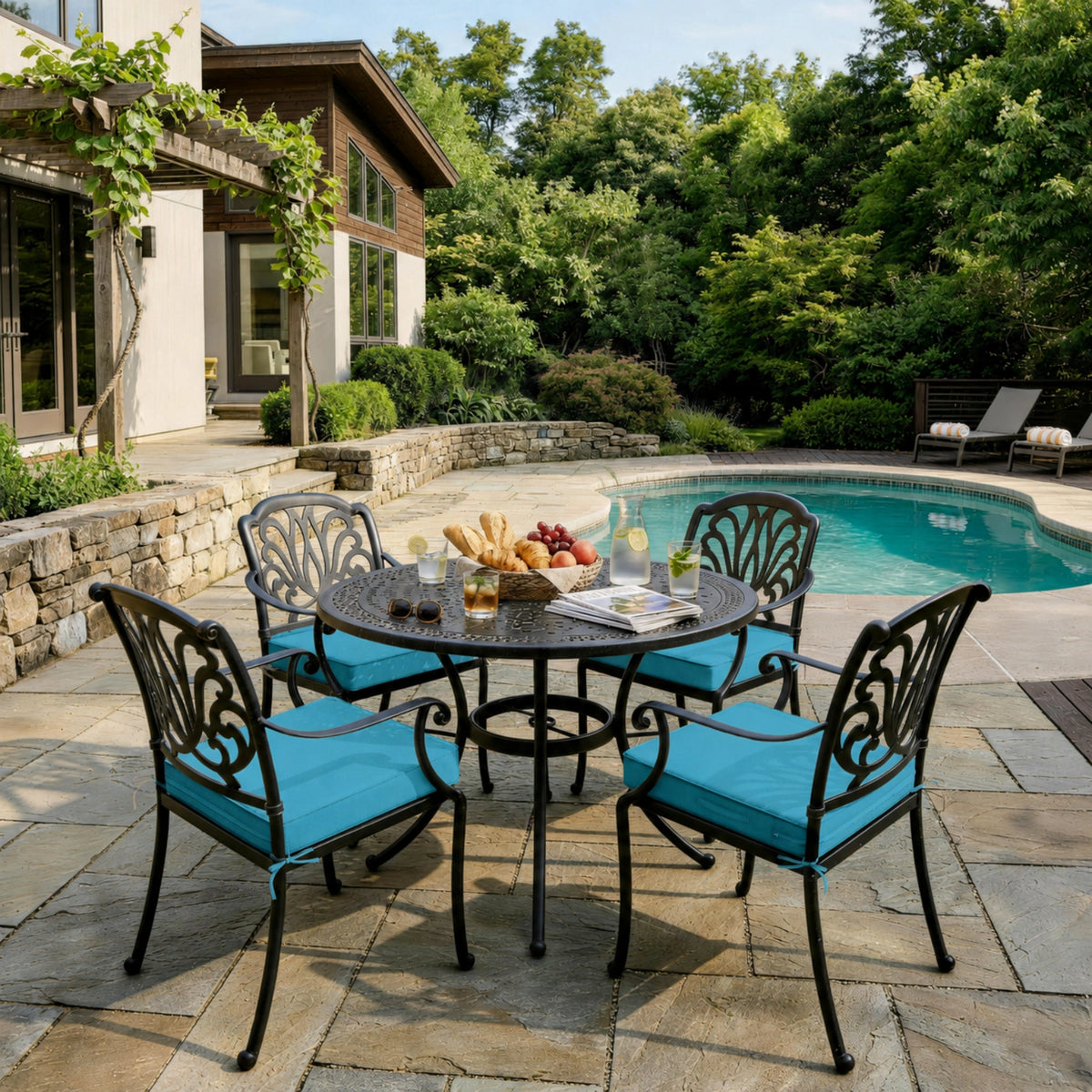 Aqua Blue outdoor seat cushions on patio chairs with a round outdoor dining table in a backyard setting.