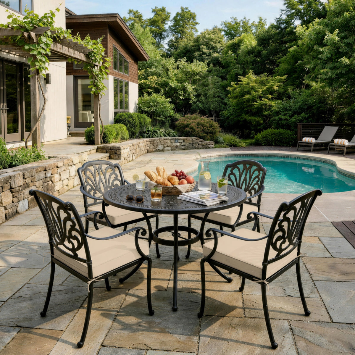 Cream outdoor seat cushions on patio chairs with a round outdoor dining table in a backyard setting.