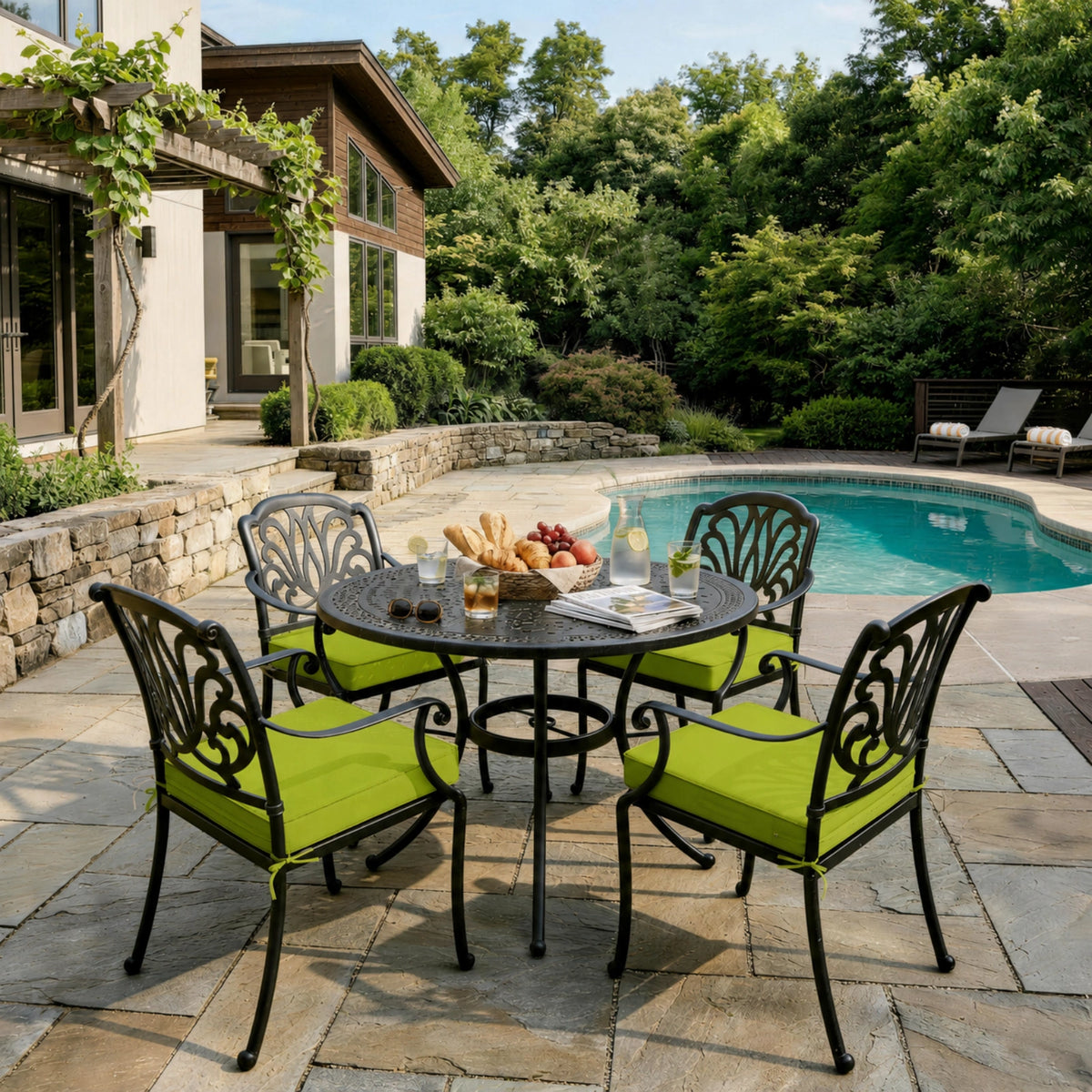 Grass Green outdoor seat cushions on patio chairs with a round outdoor dining table in a backyard setting.
