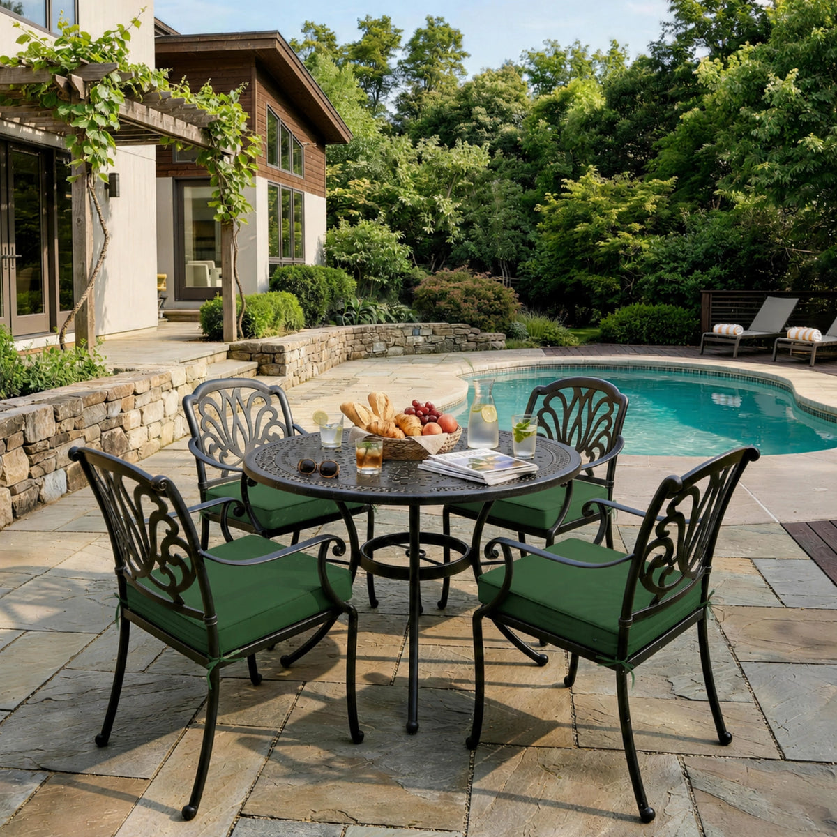Olive Green outdoor seat cushions on patio chairs with a round outdoor dining table in a backyard setting.