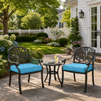 outdoor seat cushions in bright blue on black metal patio chairs, styled in a sunny backyard garden with a small outdoor side table