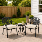 deep outdoor seat cushions in cream on black metal patio chairs, styled in a clean backyard seating area