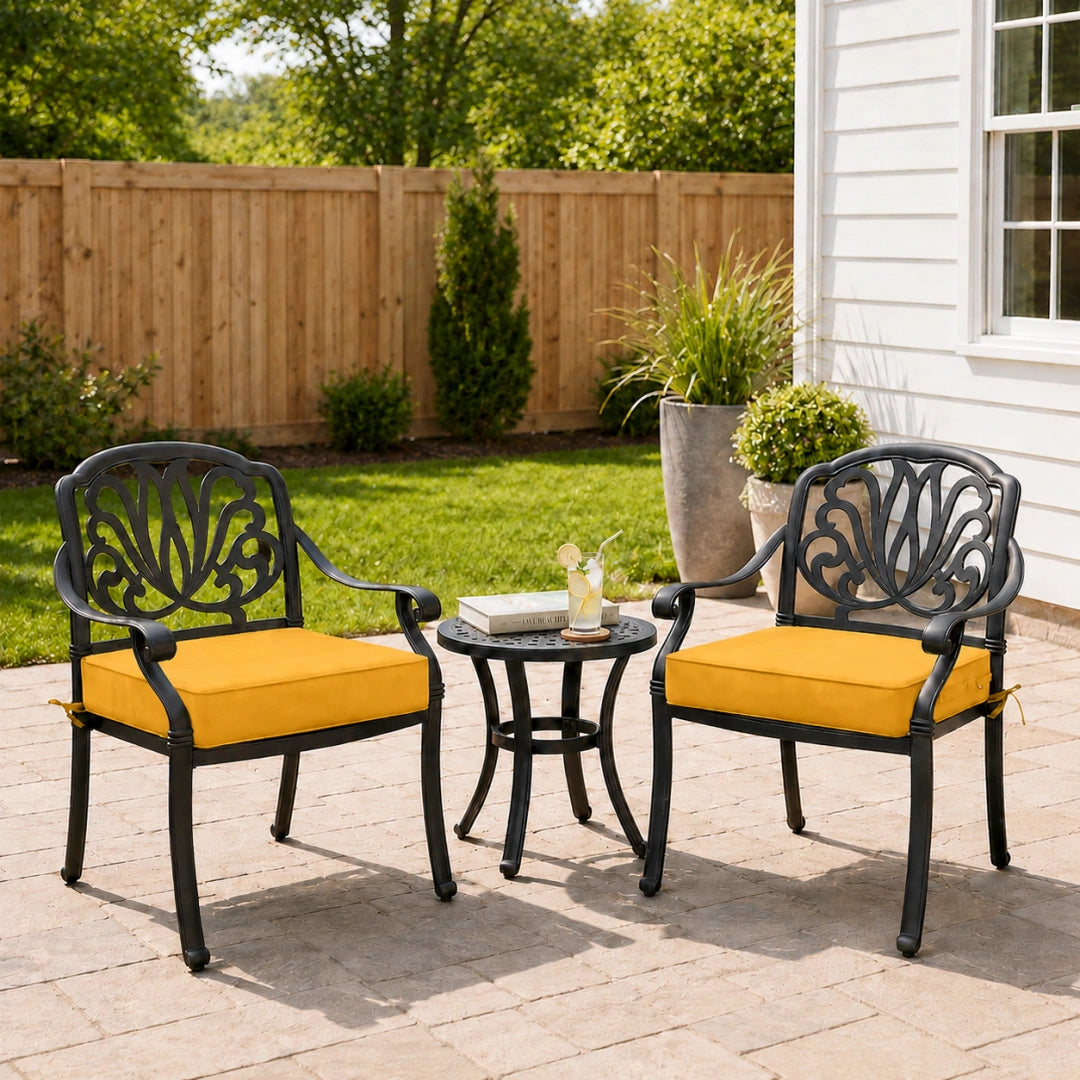 outdoor deep seat cushions in yellow on decorative metal garden chairs, styled for a sunny patio seating space