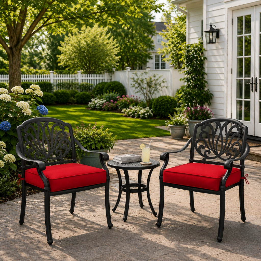 outdoor lounge chair seat cushions in red on black metal chairs, displayed in a backyard patio garden scene
