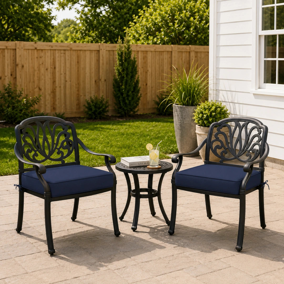 outdoor seat cushion style in navy blue on black metal patio chairs, shown in a backyard outdoor seating setup
