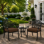 outdoor seat cushions in brown on black metal patio chairs, styled in a sunny backyard garden with a small outdoor table
