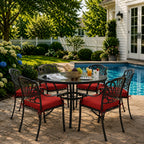 outdoor seat cushions in crimson red on black metal patio chairs, styled in a sunny backyard garden with a small round outdoor table