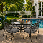 outdoor seat cushions in gray on black metal patio chairs, styled in a sunny backyard garden with a small round outdoor table