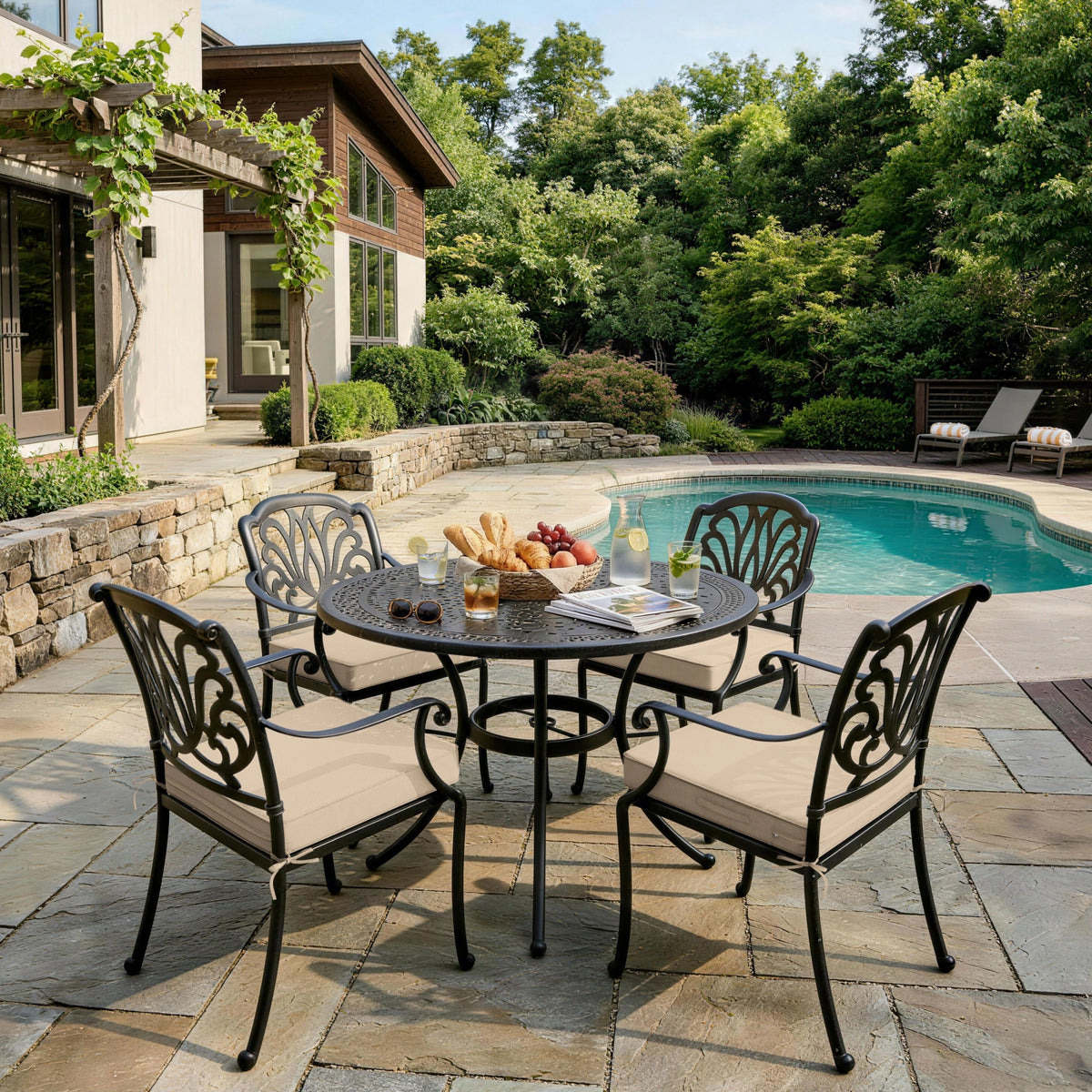 Sand outdoor seat cushions on patio chairs with a round outdoor dining table in a backyard setting.