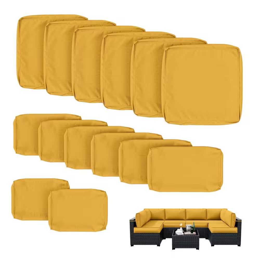 Set of yellow outdoor cushions arranged around a sectional sofa on a white background